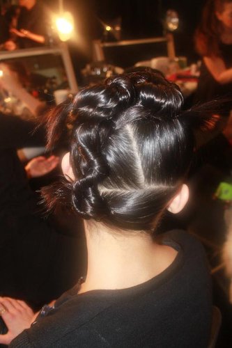 The second style was a twisted and twirled updo with straight, sharp partings. If you want to get a perfect part every time, remember Pecis's tip: "Put a little water on the hair, and brush through with the teeth. Watch where the hair starts to split, and from there use the tail comb to help refine it."
The second style was a twisted and twirled updo with straight, sharp partings. If you want to get a perfect part every time, remember Pecis's tip: "Put a little water on the hair, and brush through with the teeth. Watch where the hair starts to split, and from there use the tail comb to help refine it."