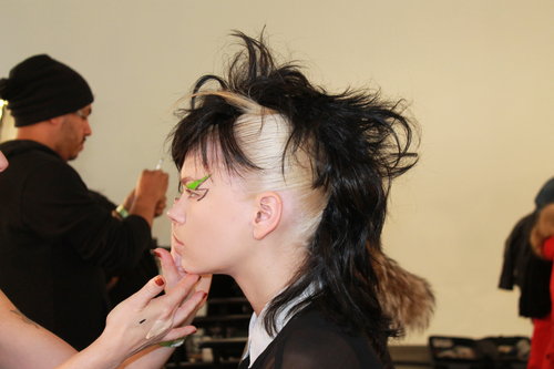 For the girls who didn't have the black hair to match the noir wigs, Souleiman pulled pieces of their hair through the wigs for a two-toned effect.
For the girls who didn't have the black hair to match the noir wigs, Souleiman pulled pieces of their hair through the wigs for a two-toned effect.