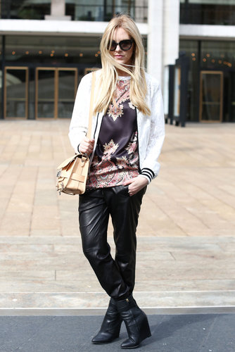 A rich print on her tee contrasted perfectly with slick leather bottoms.
A rich print on her tee contrasted perfectly with slick leather bottoms.