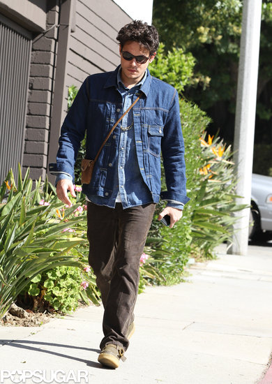 John Mayer carried a small bag with him. John Mayer carried a small bag with him.