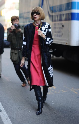 Anna Wintour made her way into the Calvin Klein Collection show in a floral Prada coat, a pink dress, black leather knee-high boots, and a few sparkly necklaces.
Anna Wintour made her way into the Calvin Klein Collection show in a floral Prada coat, a pink dress, black leather knee-high boots, and a few sparkly necklaces.