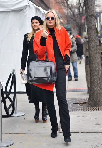 Red-hot hues on her coat livened up her black top and pants.
Red-hot hues on her coat livened up her black top and pants.