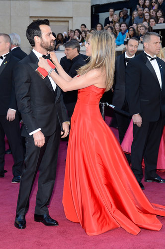 Jennifer Aniston straightened out Justin Theroux's bow tie on the Oscars red carpet.
Jennifer Aniston straightened out Justin Theroux's bow tie on the Oscars red carpet.