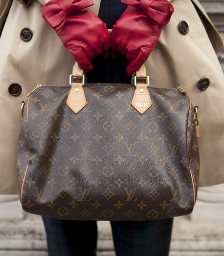 Louis Vuitton bag, red gloves, and a trench coat made for a polished pairing.
Louis Vuitton bag, red gloves, and a trench coat made for a polished pairing.