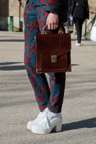 A structured satchel and white shoes melded modern and vintage in one outfit.
A structured satchel and white shoes melded modern and vintage in one outfit.