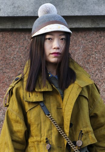 A Burberry pom hat added a whimsical touch to a utilitarian Fashion Week outfit.
A Burberry pom hat added a whimsical touch to a utilitarian Fashion Week outfit.