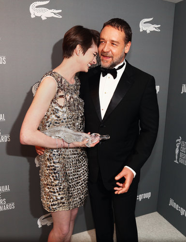 Anne Hathaway laughed with Russell Crowe after he presented her with a Lacoste spotlight award at the Costume Designers Guild Awards.
Anne Hathaway laughed with Russell Crowe after he presented her with a Lacoste spotlight award at the Costume Designers Guild Awards.