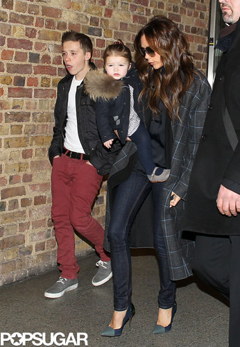 Victoria Beckham carried baby Harper in her arms while walking with Brooklyn Beckham in February.
Victoria Beckham carried baby Harper in her arms while walking with Brooklyn Beckham in February.