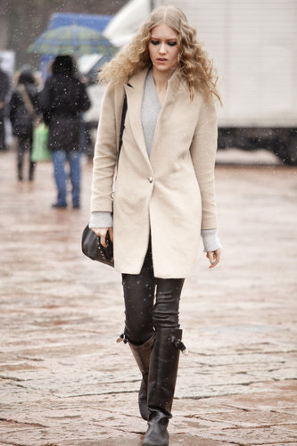 A sleek coat gave buckled boots a minimalist counterpoint.
A sleek coat gave buckled boots a minimalist counterpoint.