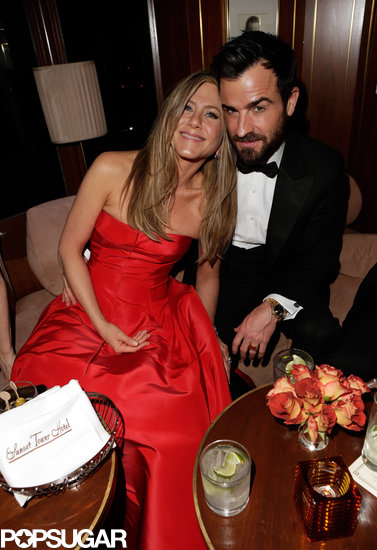 Jennifer Aniston cuddle up to fiancé Justin Theroux at Vanity Fair's Oscar afterparty.
Jennifer Aniston cuddle up to fiancé Justin Theroux at Vanity Fair's Oscar afterparty.