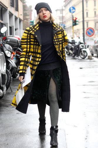A bright yellow coat livened up the moody palette in this look.
A bright yellow coat livened up the moody palette in this look.