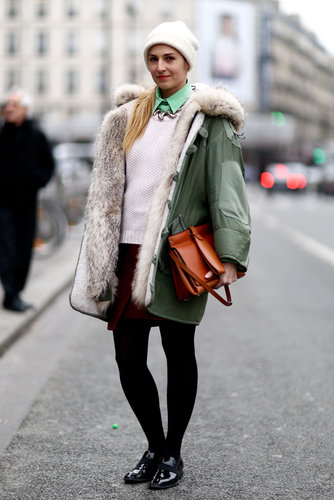 This showgoer bundled up her preppy look with the coziest kind of anorak.
This showgoer bundled up her preppy look with the coziest kind of anorak.