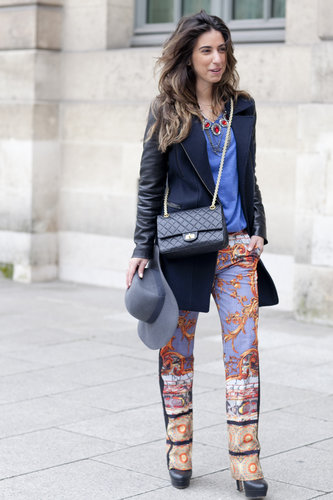 This showgoer gave her printed trousers just the right touch with a simplified coat and solid blue tee.
This showgoer gave her printed trousers just the right touch with a simplified coat and solid blue tee.