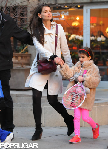 Suri Picks Up a Pink Racket For Tennis With Katie Holmes Suri Picks Up a Pink Racket For Tennis With Katie Holmes
