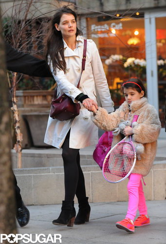 Suri Picks Up a Pink Racket For Tennis With Katie Holmes Suri Picks Up a Pink Racket For Tennis With Katie Holmes