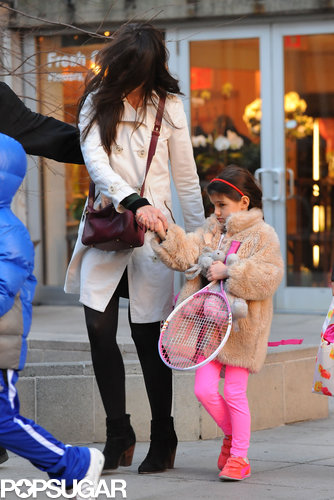Suri Picks Up a Pink Racket For Tennis With Katie Holmes Suri Picks Up a Pink Racket For Tennis With Katie Holmes