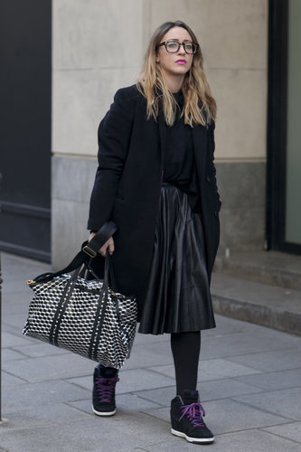 Nike wedges furthered the street-chic vibe of a leather skirt and geeky specs.
Nike wedges furthered the street-chic vibe of a leather skirt and geeky specs.