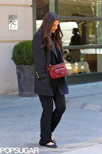 Katie Holmes kept warm in a coat.
Katie Holmes kept warm in a coat.