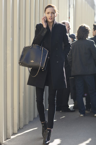 Tougher accents, like the studs on her Valentino bag and zippers on her boots, are the subtle details that made a big difference here.
Tougher accents, like the studs on her Valentino bag and zippers on her boots, are the subtle details that made a big difference here.