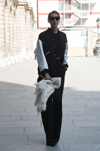 A varsity jacket toughed up the minimalist feel of her crop top and wide leg pants.
A varsity jacket toughed up the minimalist feel of her crop top and wide leg pants.
