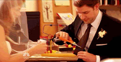 Whether it's the pregnancy or just regular nerves, Pam starts to stress on their wedding day. Before their ceremony, Pam tells Jim that she's torn the veil, Jim cuts off his tie to make her feel better, and they run off together.
Whether it's the pregnancy or just regular nerves, Pam starts to stress on their wedding day. Before their ceremony, Pam tells Jim that she's torn the veil, Jim cuts off his tie to make her feel better, and they run off together.