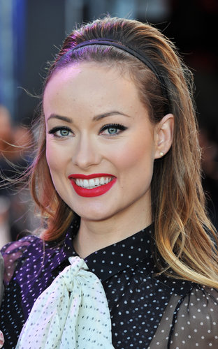 At the London Cowboys & Aliens premiere, Olivia turned up the heat with a bright red lip color and voluminous hairstyle.
At the London Cowboys & Aliens premiere, Olivia turned up the heat with a bright red lip color and voluminous hairstyle.