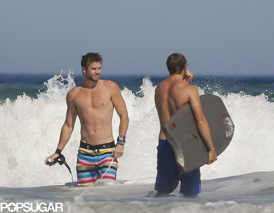Shirtless Liam Hemsworth Flexes His Muscles on the Beach Shirtless Liam Hemsworth Flexes His Muscles on the Beach
