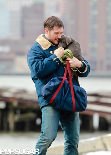 Tom Hardy Cuddles Up to a Canine Costar on Set Tom Hardy Cuddles Up to a Canine Costar on Set