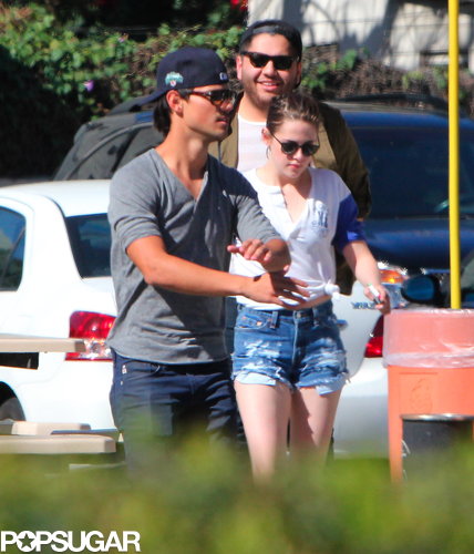 Kristen Stewart and Taylor Lautner hung out at the batting cages with friends.
Kristen Stewart and Taylor Lautner hung out at the batting cages with friends.