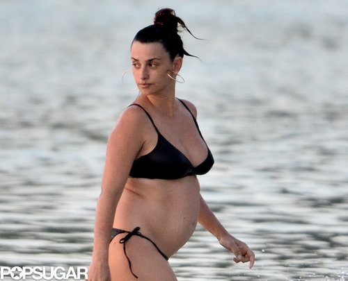Penélope Cruz showed off her baby bump in a black bikini.
Penélope Cruz showed off her baby bump in a black bikini.
