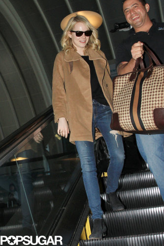Emma Stone was all smiles as she traveled.
Emma Stone was all smiles as she traveled.