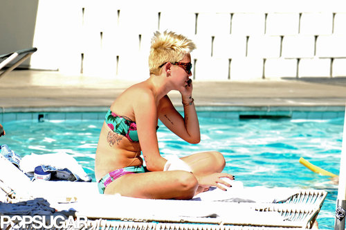 Miley Cyrus lounged poolside in a bikini.
Miley Cyrus lounged poolside in a bikini.