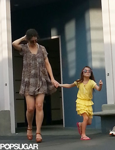 Katie Holmes held Suri's hand at Disney World.
Katie Holmes held Suri's hand at Disney World.