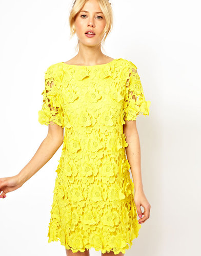 We love the texture of this ASOS yellow flower lace shift dress ($203) and would pair it with white ankle-strap sandals for a fresh-as-flowers feel.
We love the texture of this ASOS yellow flower lace shift dress ($203) and would pair it with white ankle-strap sandals for a fresh-as-flowers feel.