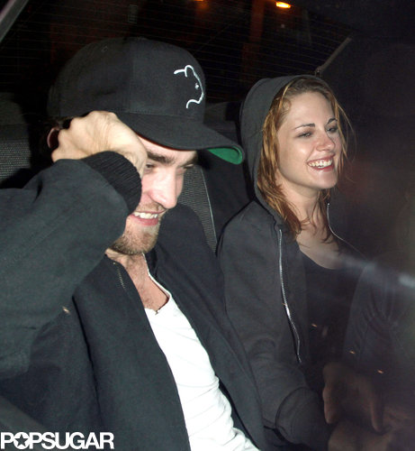Robert Pattinson and Kristen Stewart shared a laugh and linked arms as they rode in a taxi together after a night out in LA in October 2010.
Robert Pattinson and Kristen Stewart shared a laugh and linked arms as they rode in a taxi together after a night out in LA in October 2010.