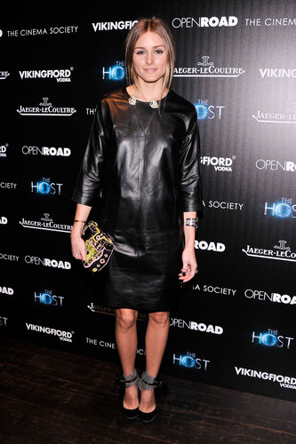 Olivia gave a minimalist leather sheath dress her signature accessory treatment with an embroidered clutch and a pair of feather-adorned heels.
Olivia gave a minimalist leather sheath dress her signature accessory treatment with an embroidered clutch and a pair of feather-adorned heels.