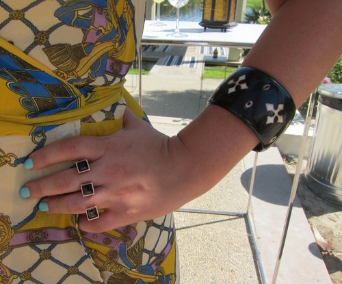 This three-finger knuckle ring and a resin bracelet were punky and pretty.
This three-finger knuckle ring and a resin bracelet were punky and pretty.