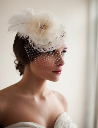 This Melinda Rose Design bridal mini hat veil ($175) emotes a sweet, throwback vibe for the art-deco bride.
This Melinda Rose Design bridal mini hat veil ($175) emotes a sweet, throwback vibe for the art-deco bride.