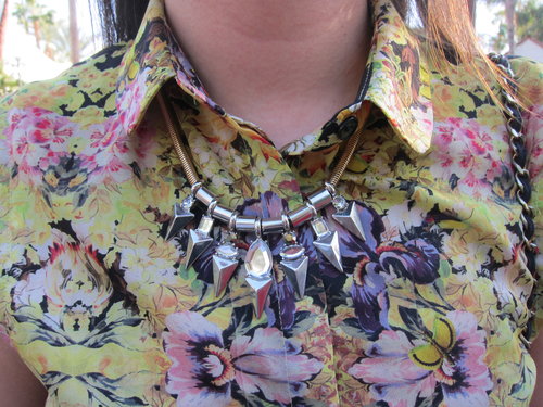 This bib necklace almost disappeared against a floral blouse . . . almost.
This bib necklace almost disappeared against a floral blouse . . . almost.