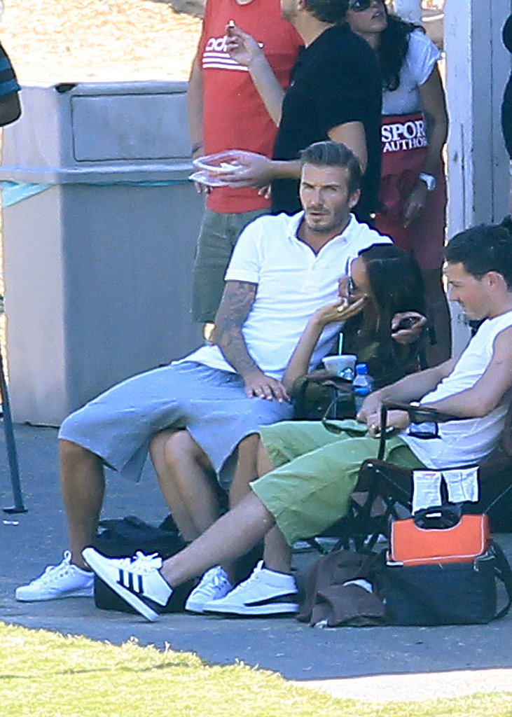 David snuggled up in Victoria's lap while they watched their boys play soccer in LA in September 2012.
David snuggled up in Victoria's lap while they watched their boys play soccer in LA in September 2012.