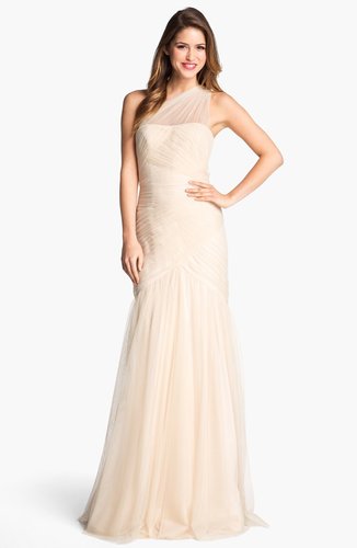 Not a white gown kind of gal? This ML Monique Lhuillier one-shoulder tulle trumpet gown ($698) is a great alternative. We adore the sheer one-shoulder detail.
Not a white gown kind of gal? This ML Monique Lhuillier one-shoulder tulle trumpet gown ($698) is a great alternative. We adore the sheer one-shoulder detail.