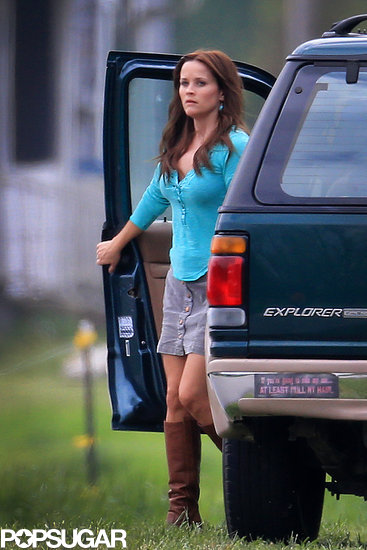 Reese Witherspoon gets out of a car with a cheeky bumper sticker. Reese Witherspoon gets out of a car with a cheeky bumper sticker.