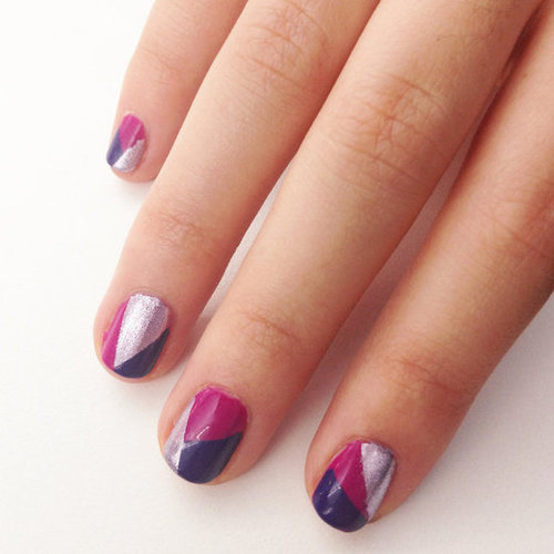 Creating a mod geometric nail design is an easy way to wear three of your favorite polish shades all at the same time.
Creating a mod geometric nail design is an easy way to wear three of your favorite polish shades all at the same time.