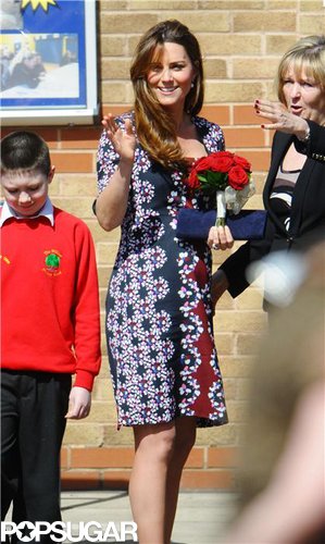 Kate Middleton held onto a bouquet of red roses.
Kate Middleton held onto a bouquet of red roses.