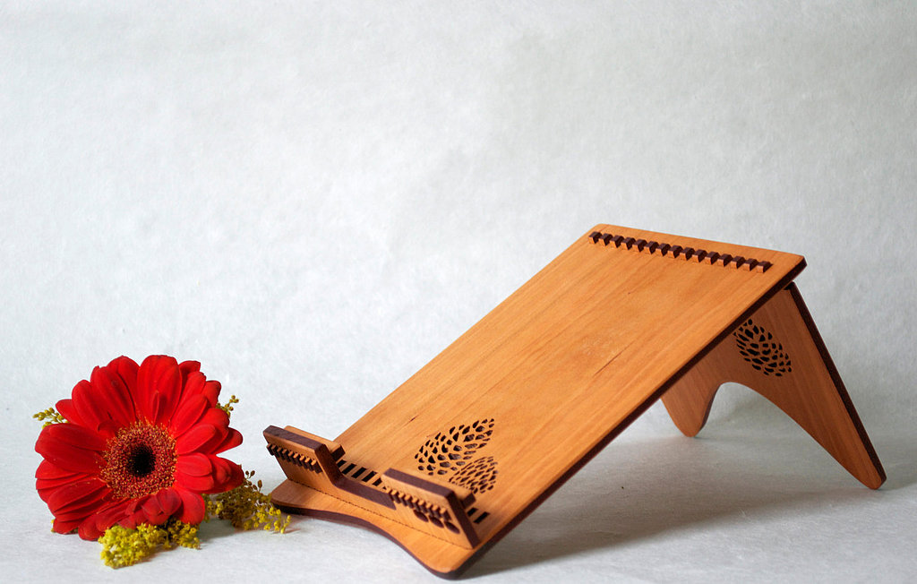 This unique, handcrafted cherry wood stand ($55) for iPad and iPad Mini brings some natural beauty into Mom's digital world. Check out the natural wood ($25) stand for iPhones too.
This unique, handcrafted cherry wood stand ($55) for iPad and iPad Mini brings some natural beauty into Mom's digital world. Check out the natural wood ($25) stand for iPhones too.