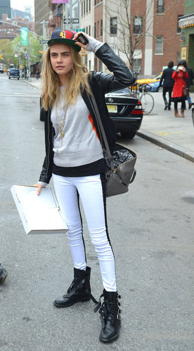 Cara Delevingne's black-and-white Hudson jeans added crisp edge to her funky NYC style. She accessorized with tough-luxe Saint Laurent boots and duffel.
Cara Delevingne's black-and-white Hudson jeans added crisp edge to her funky NYC style. She accessorized with tough-luxe Saint Laurent boots and duffel.
