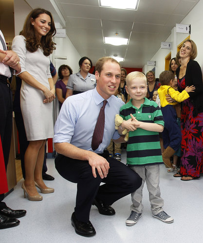 Kate Middleton looked on while Prince William posed with a young boy at London's Royal Marsden Hospital in September 2011.
Kate Middleton looked on while Prince William posed with a young boy at London's Royal Marsden Hospital in September 2011.