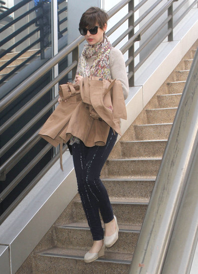 Anne Hathaway's casual travel style, including printed Paige Denim jeans, got a feminine jolt thanks to her floral scarf.
Anne Hathaway's casual travel style, including printed Paige Denim jeans, got a feminine jolt thanks to her floral scarf.