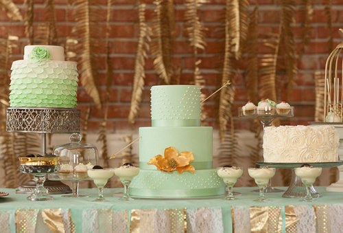 Although there's more than one cake on this dessert table, our eyes are on the mint-colored stunner in the middle. A delicate pearl pattern, large flower, and fun hue are all it takes to make this one swoon-worthy cake.
Photo by La Luz Photography via 100 Layer Cake
Although there's more than one cake on this dessert table, our eyes are on the mint-colored stunner in the middle. A delicate pearl pattern, large flower, and fun hue are all it takes to make this one swoon-worthy cake.
Photo by La Luz Photography via 100 Layer Cake