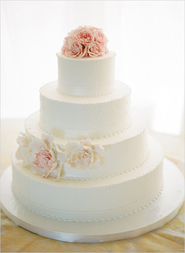 Love the idea of a traditional cake but don't want all the fuss that comes with it? Then you'll want to take note of this sleek version — with just a few beaded details and flower accents, it's both clean and sophisticated.
Photo by Kristin Sweeting via Wedding Chicks
Love the idea of a traditional cake but don't want all the fuss that comes with it? Then you'll want to take note of this sleek version — with just a few beaded details and flower accents, it's both clean and sophisticated.
Photo by Kristin Sweeting via Wedding Chicks